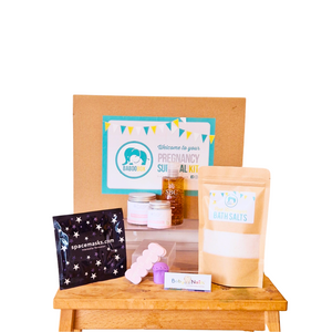 A gift box for new mum  after a C-Section, thumble baby nail file, arnica gel for bruises, scar healing cream, soothing nipple cream, pink himalayan bath salts