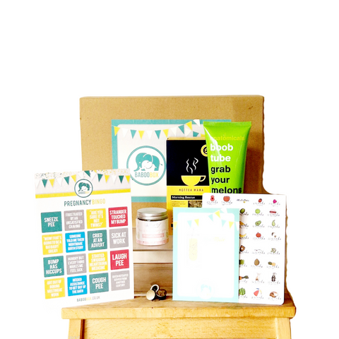 first trimester pregnancy gift box. Body moisturiser, ginger morning sickness tea, stretch mark cream, pregnancy bingo